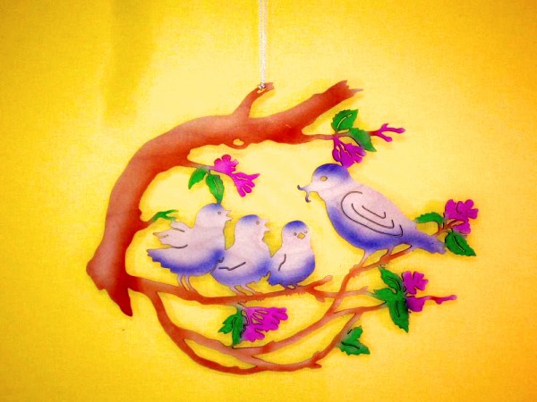 Fensterbild Amselfamilie