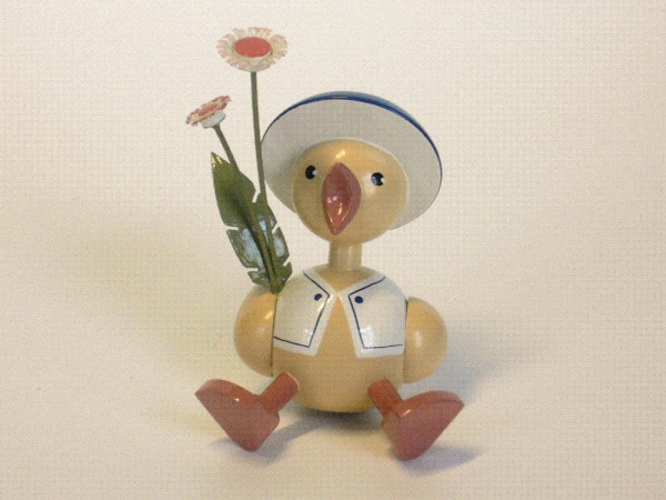 Küken mit Gänseblume